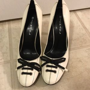 White patent leather pumps
